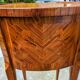 Old oval bedside table in rosewood marquetry Louis XV style