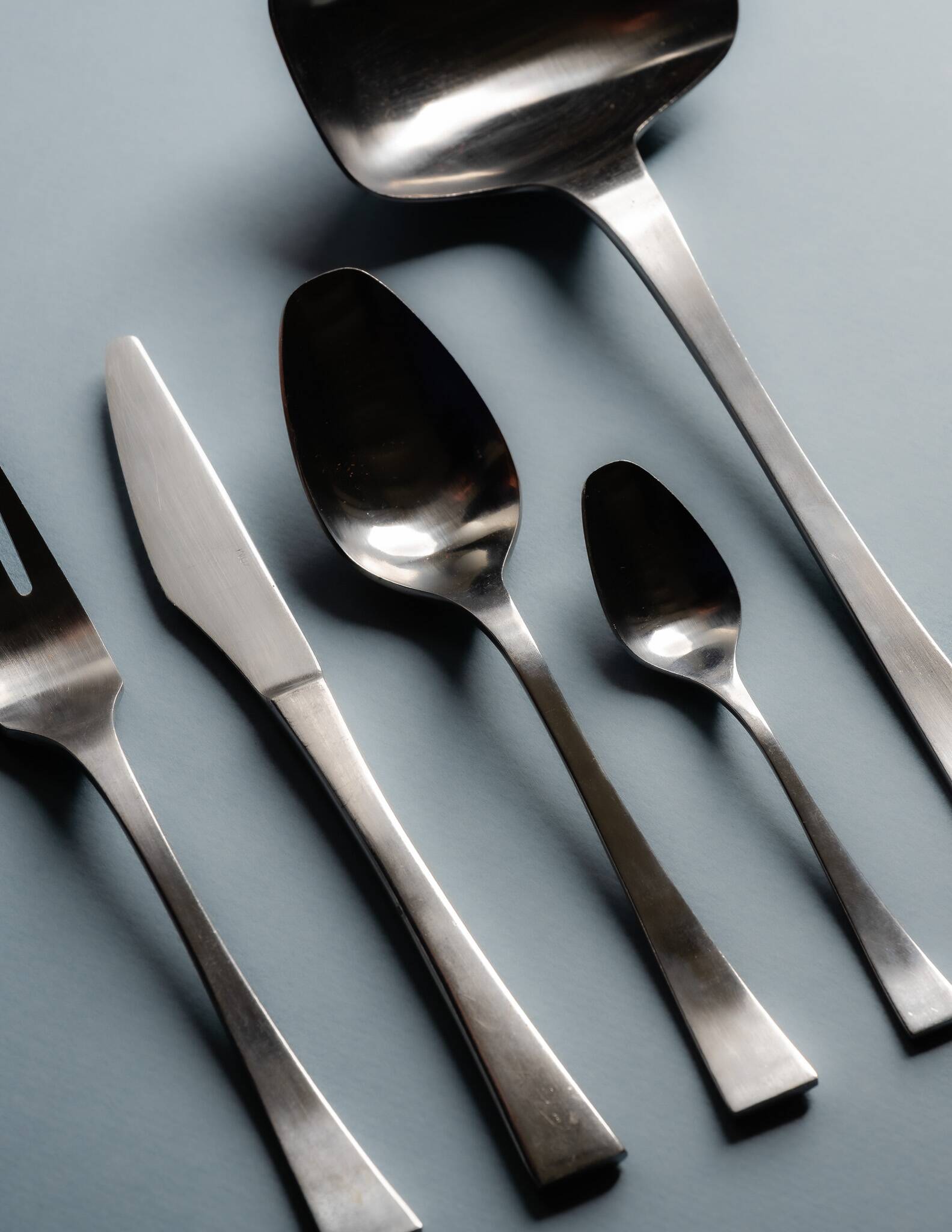 GUY DEGRENNE STAINLESS STEEL CUTLERY SET, 1970s