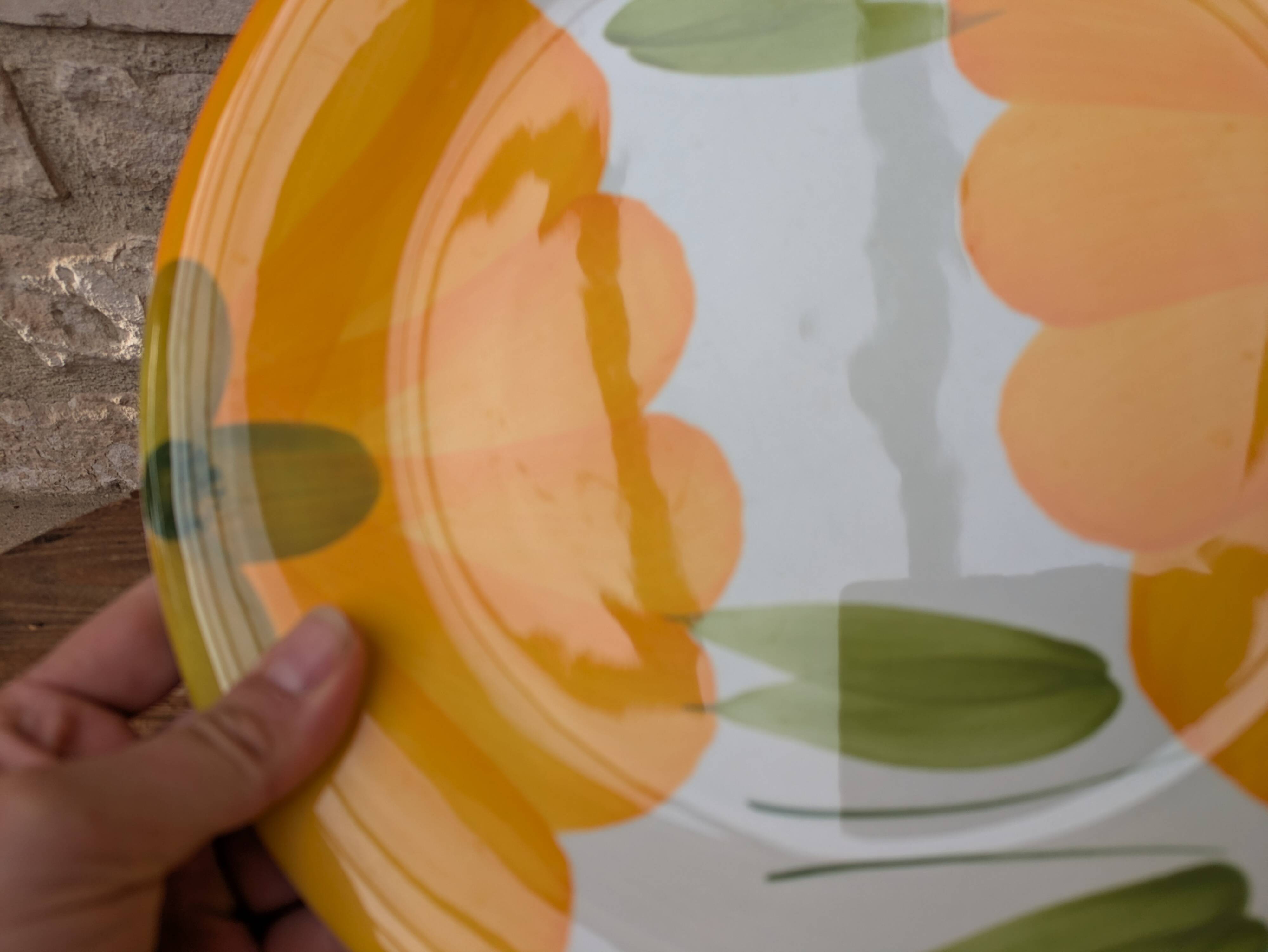 Round serving dish with hand-painted yellow flowers in ceramic TC Italy.