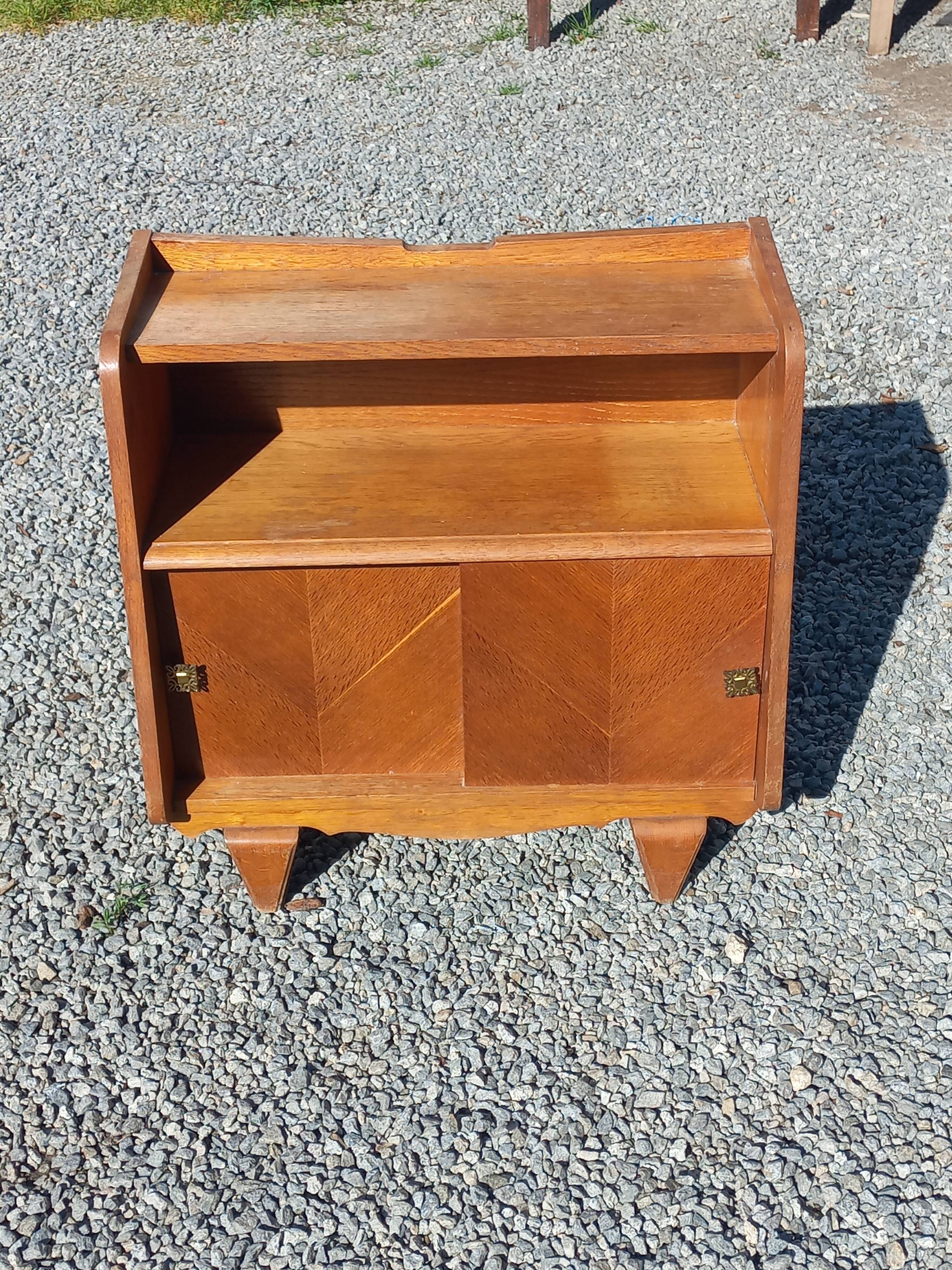 Vintage accent furniture in golden blonde oak with 2 sliding doors.