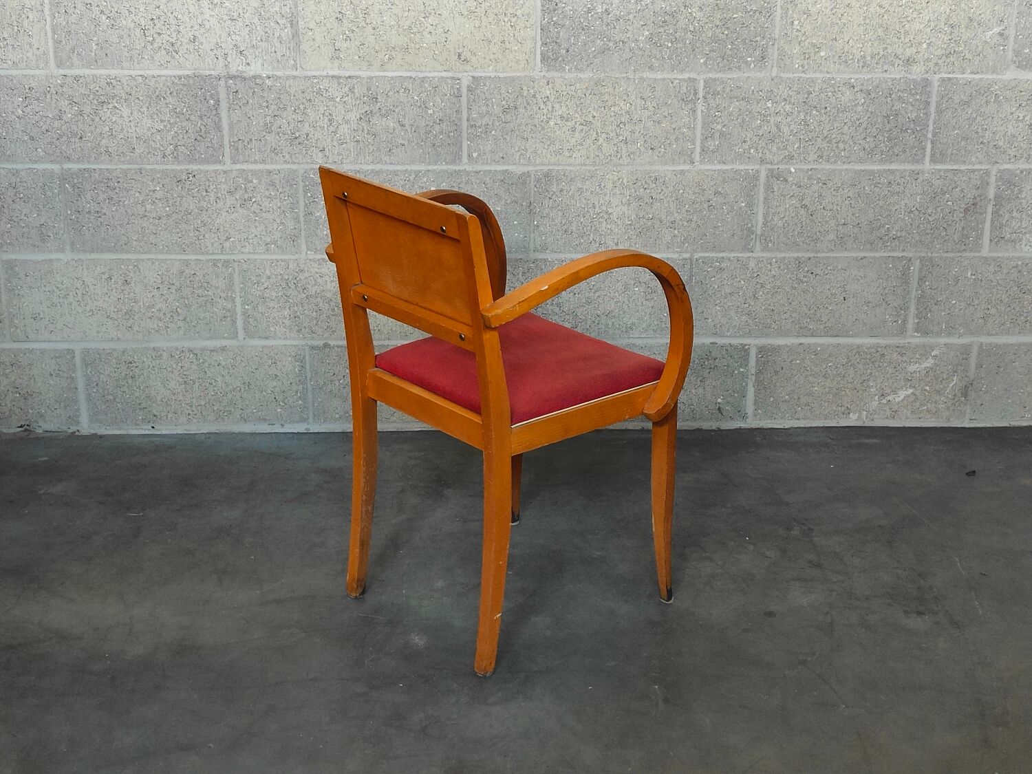 Small red bridge chair with armrests