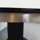 Vintage dining table in melamine with a black wood effect and chrome metal.