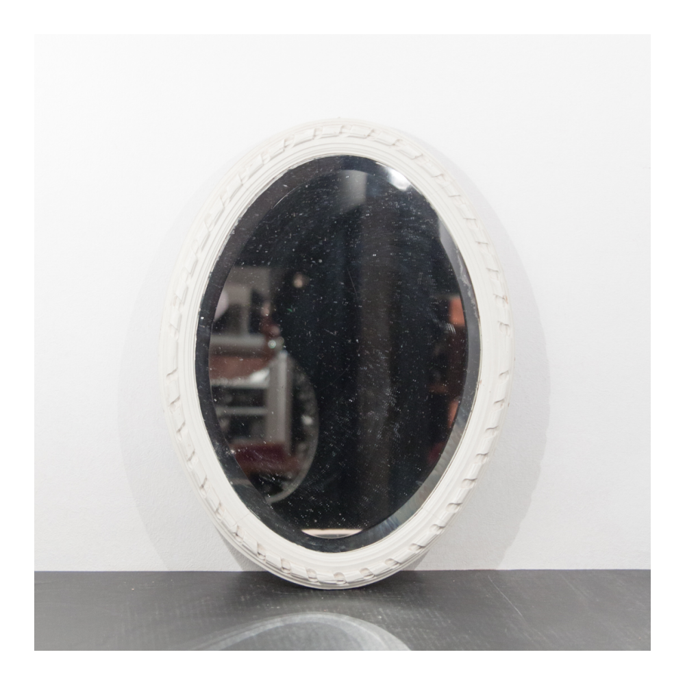 Mirror of the 1950s with a painted wooden frame and an oval ice.