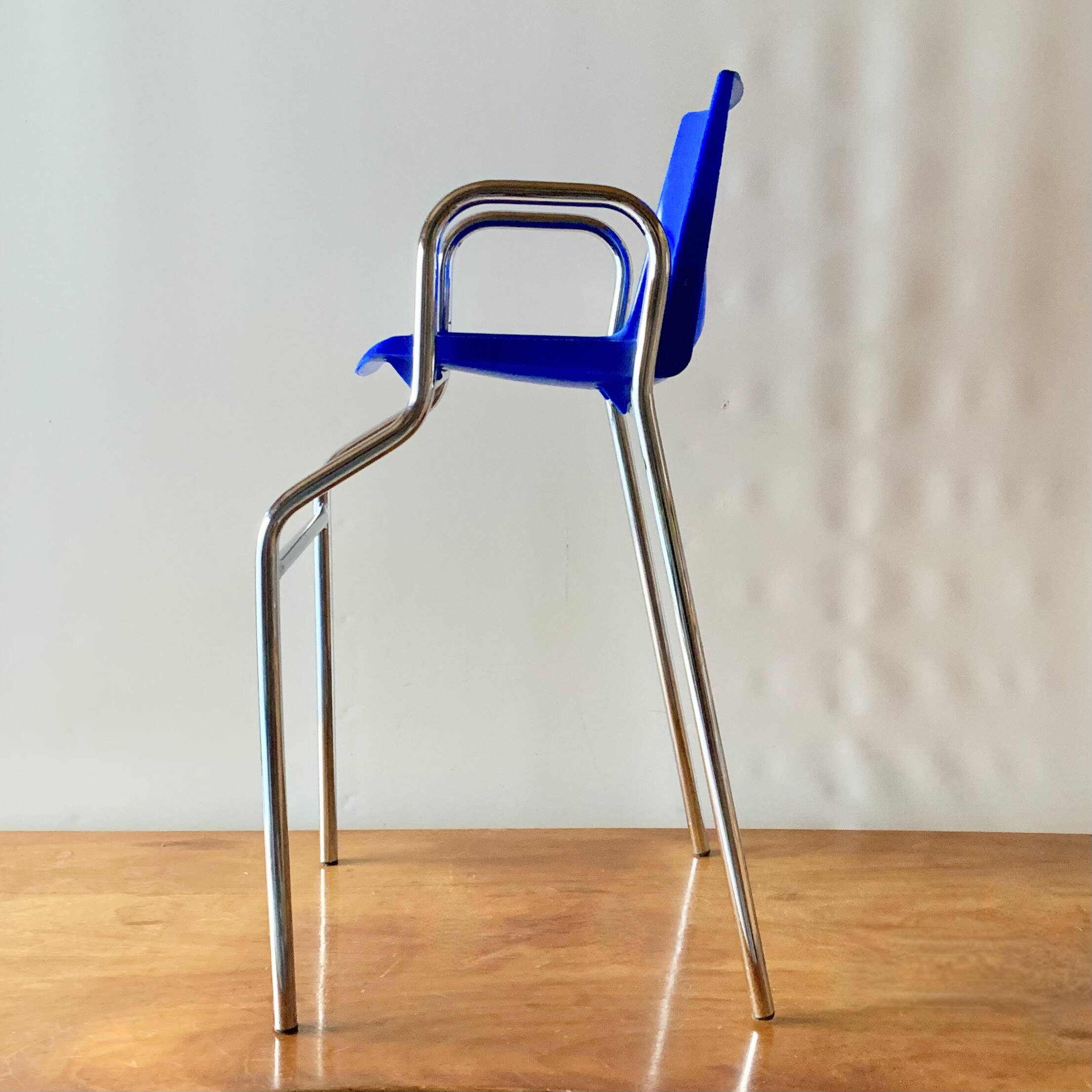 Vintage high chair for children in chrome metal and blue plastic