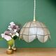 Vintage pendant light in mother-of-pearl and brass.