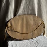 Small oval Art Deco mirror in brown and gold 33x54.