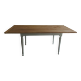 Farmhouse table with pearl gray base and raw wood top.