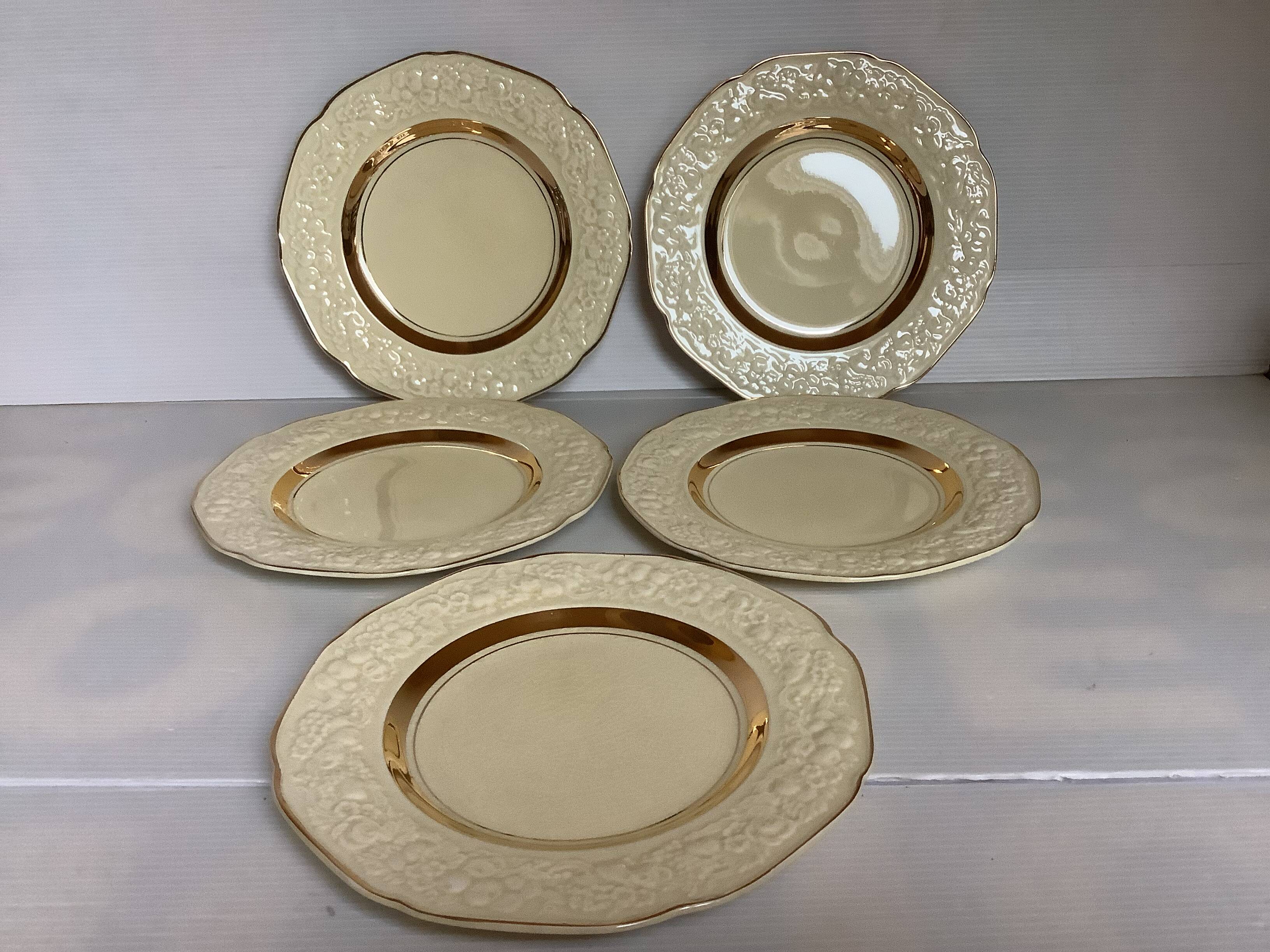 Five small floral plates England