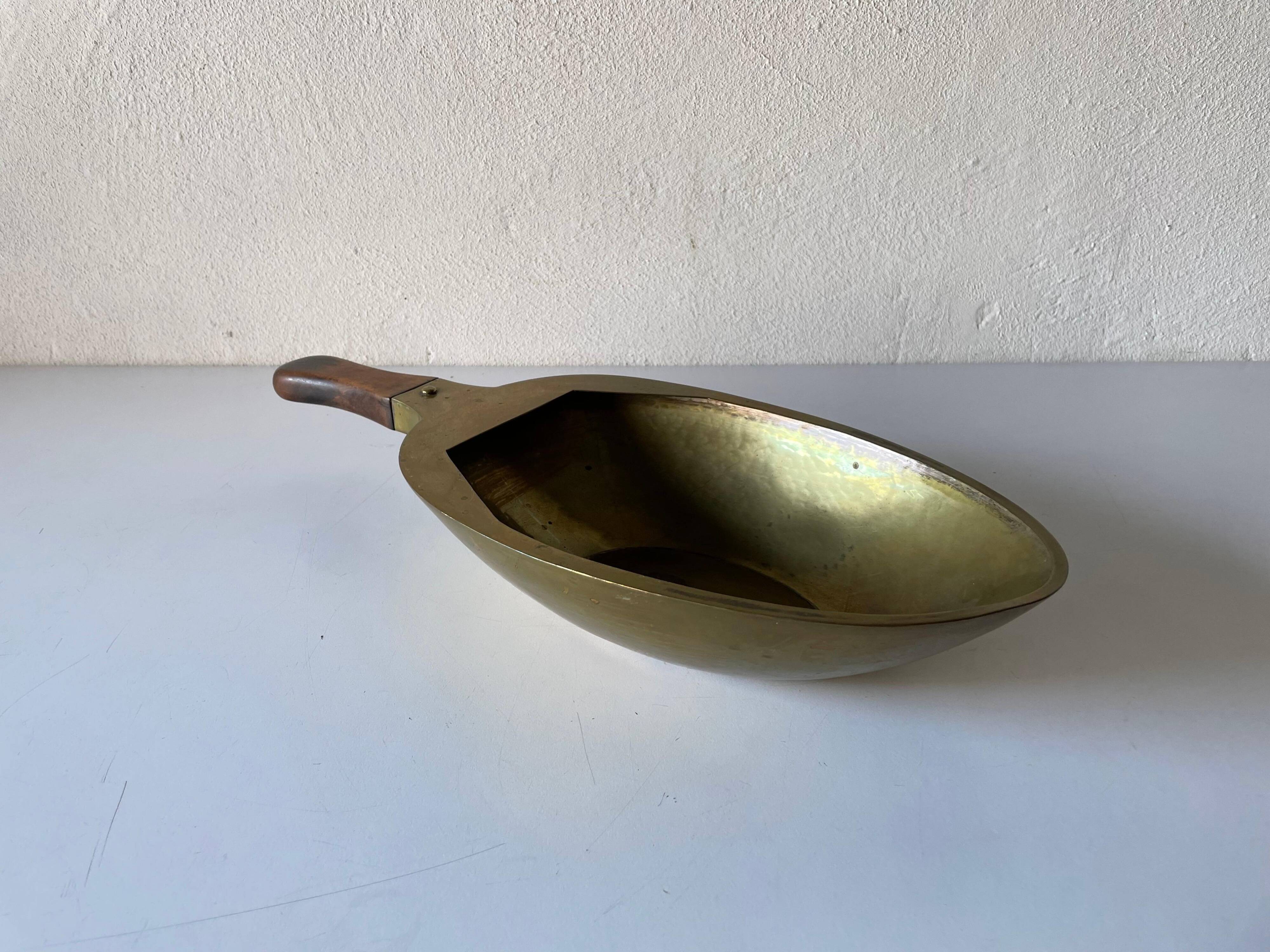 Decorative brass bowl with wooden handle, 1970s, Turin, Italy.