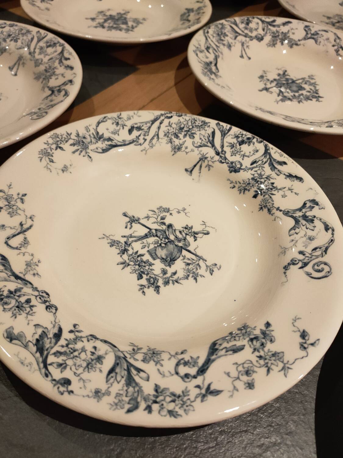 Service of old Gien earthenware plates and dishes