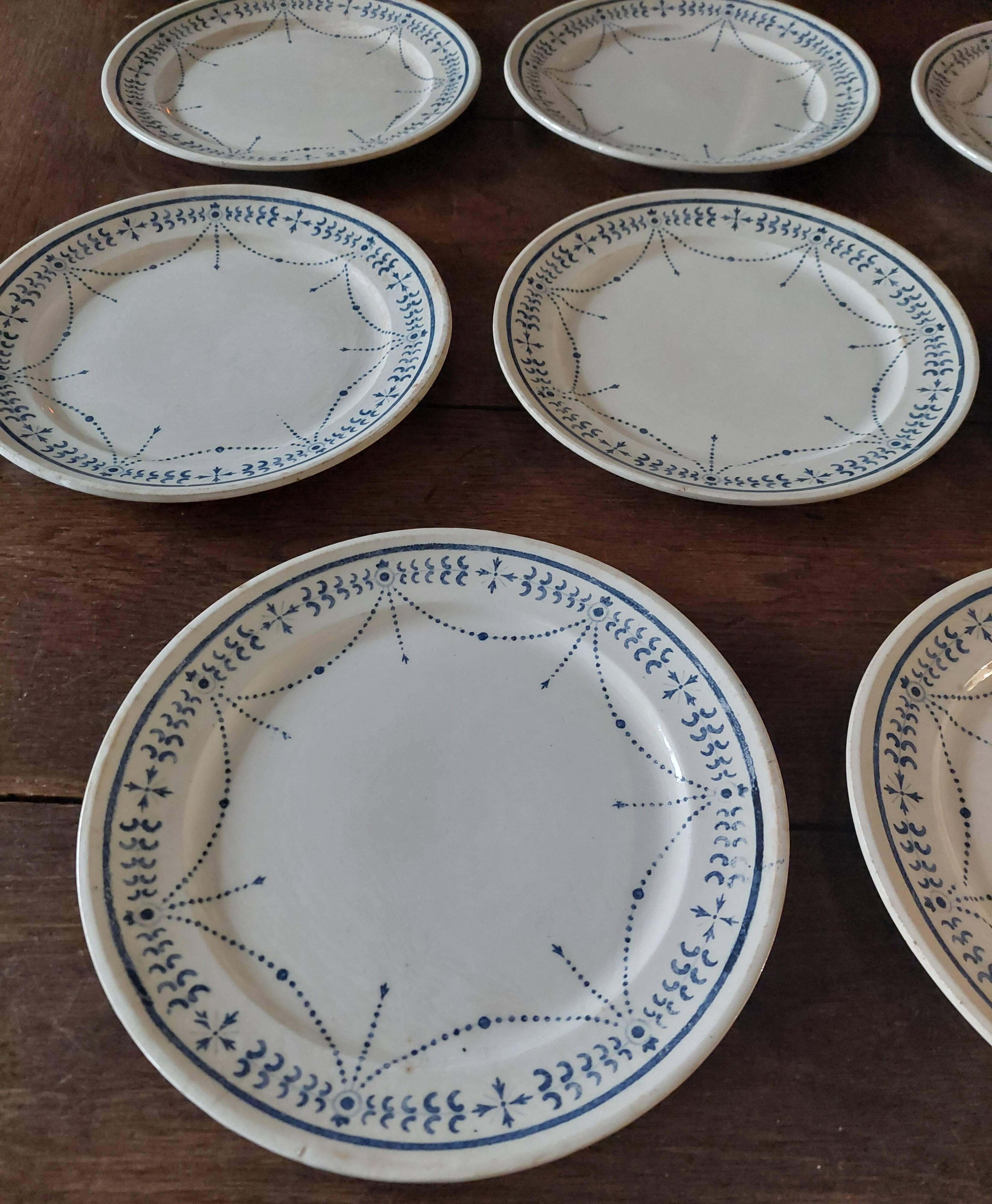 Set of eight flat plates, ironstone, Géon Rouard, Lille decoration, years.