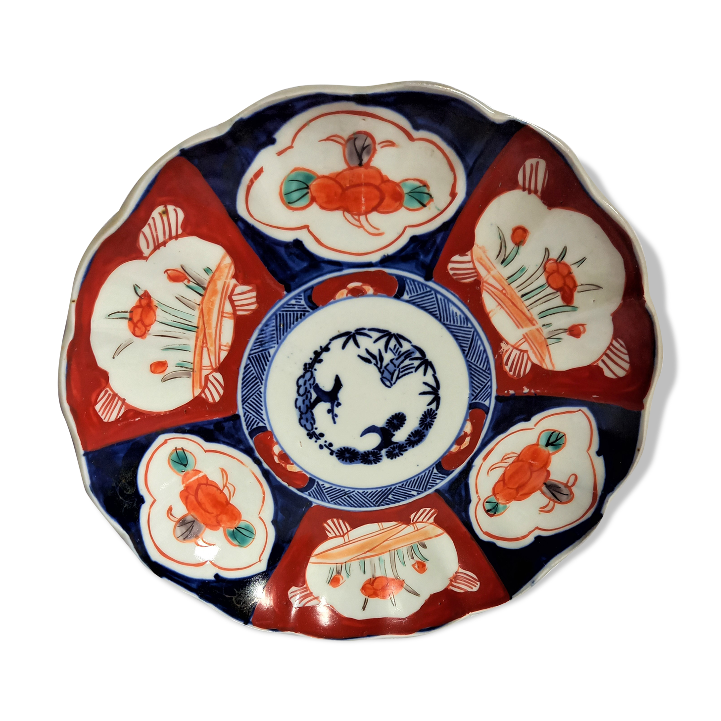 Antique plate in polychrome porcelain IMARI, Japan, red, orange and blue floral decoration.