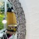 Vintage oval wicker mirror from the 1960s.