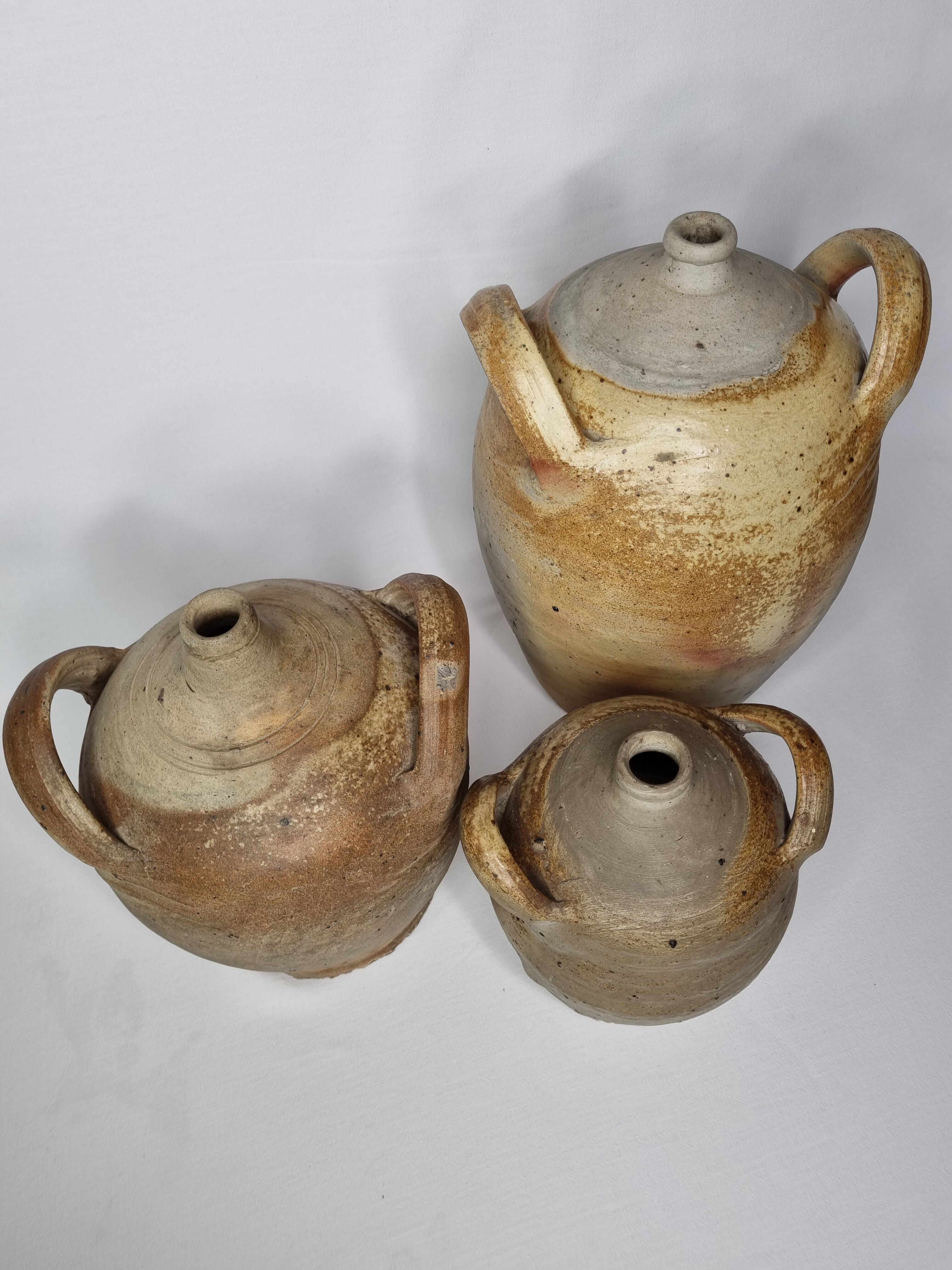 Set of three ancient ladies-jeannes in enamelled terracotta