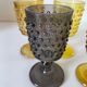 4 vintage stemmed glasses in hobnail glass and smoke colour.