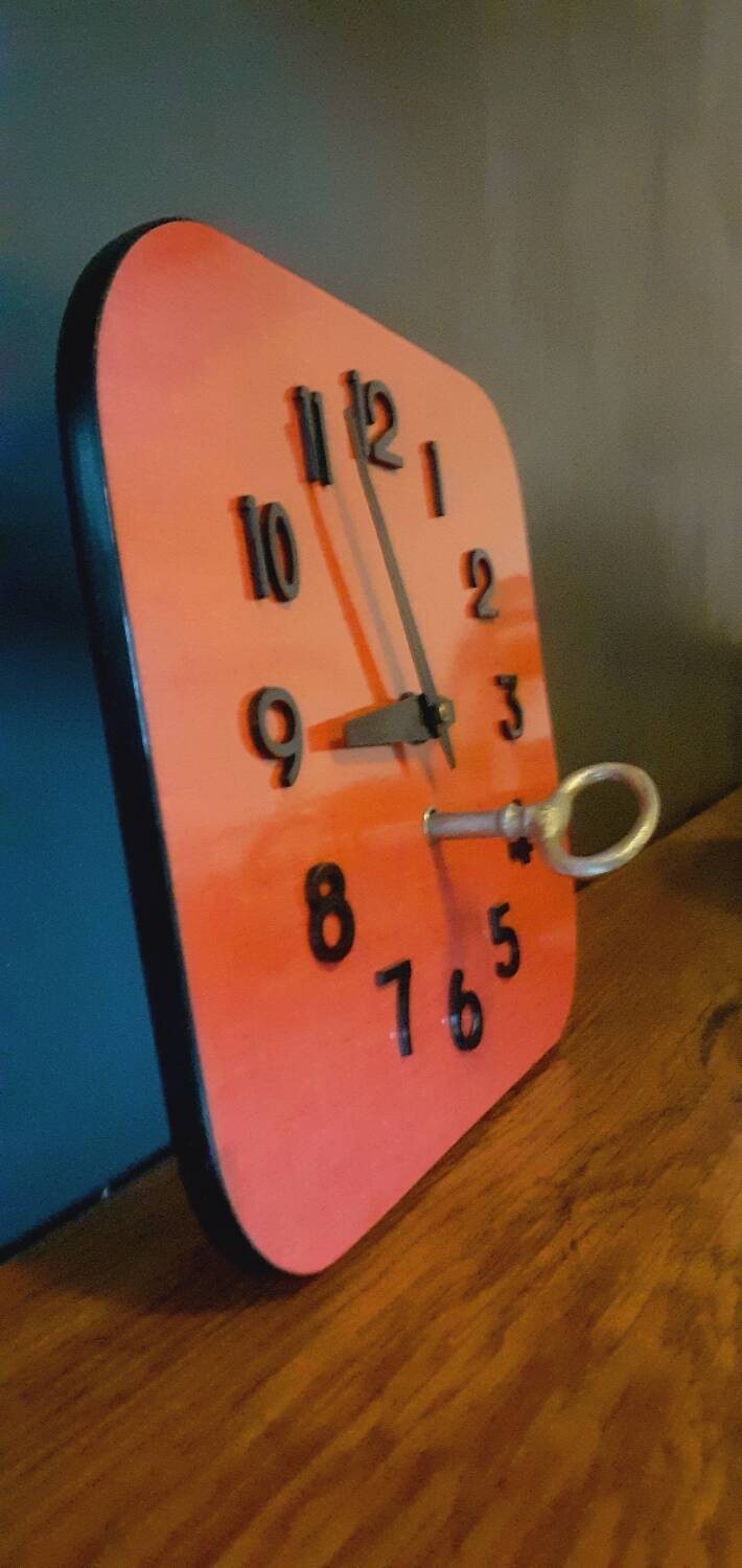 Vintage wall clock from the 50s in red formca