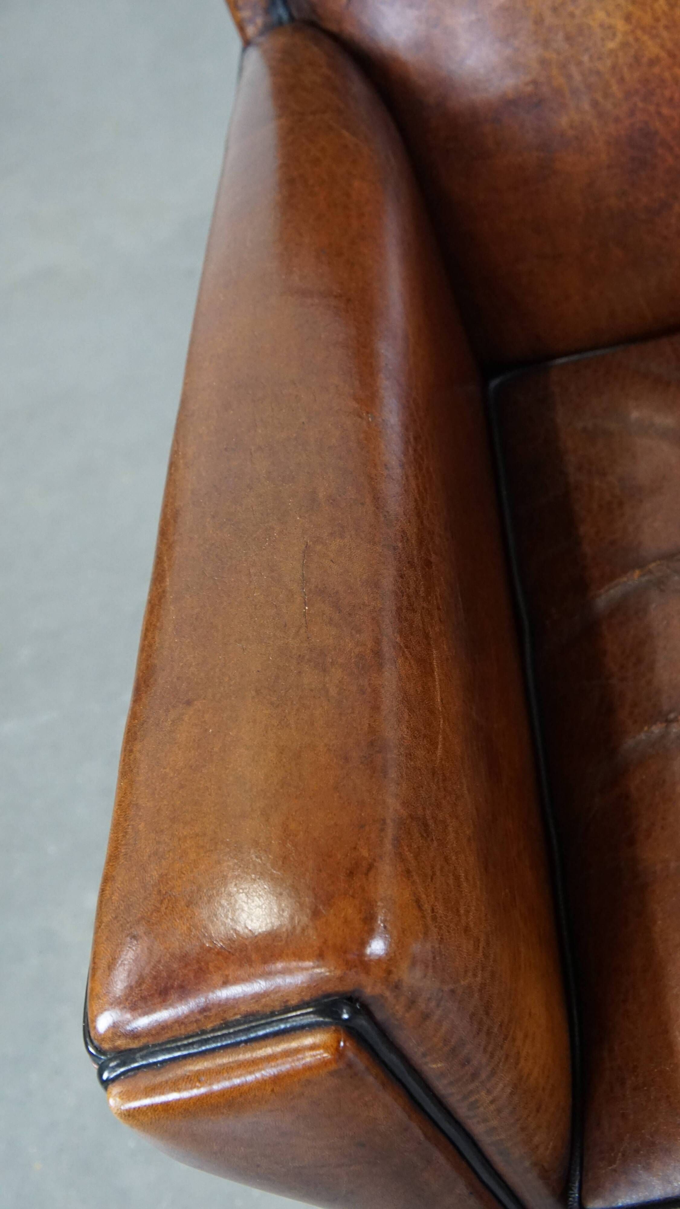 Cognac-colored sheep leather Art Deco design armchair finished with piping