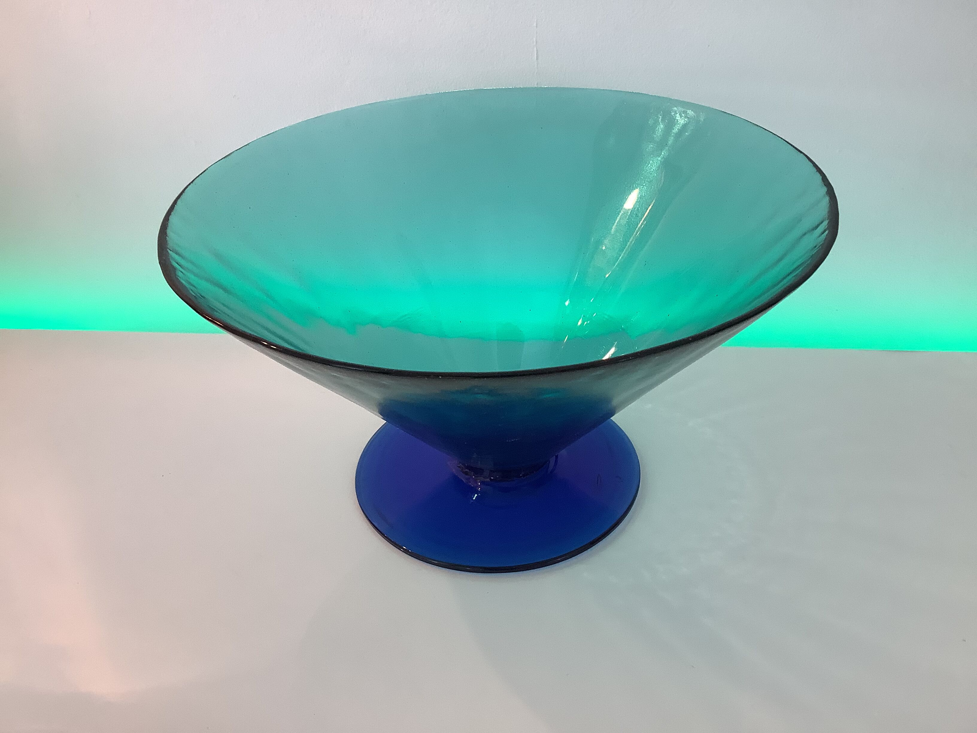 Glass fruit cup on foot, green and blue