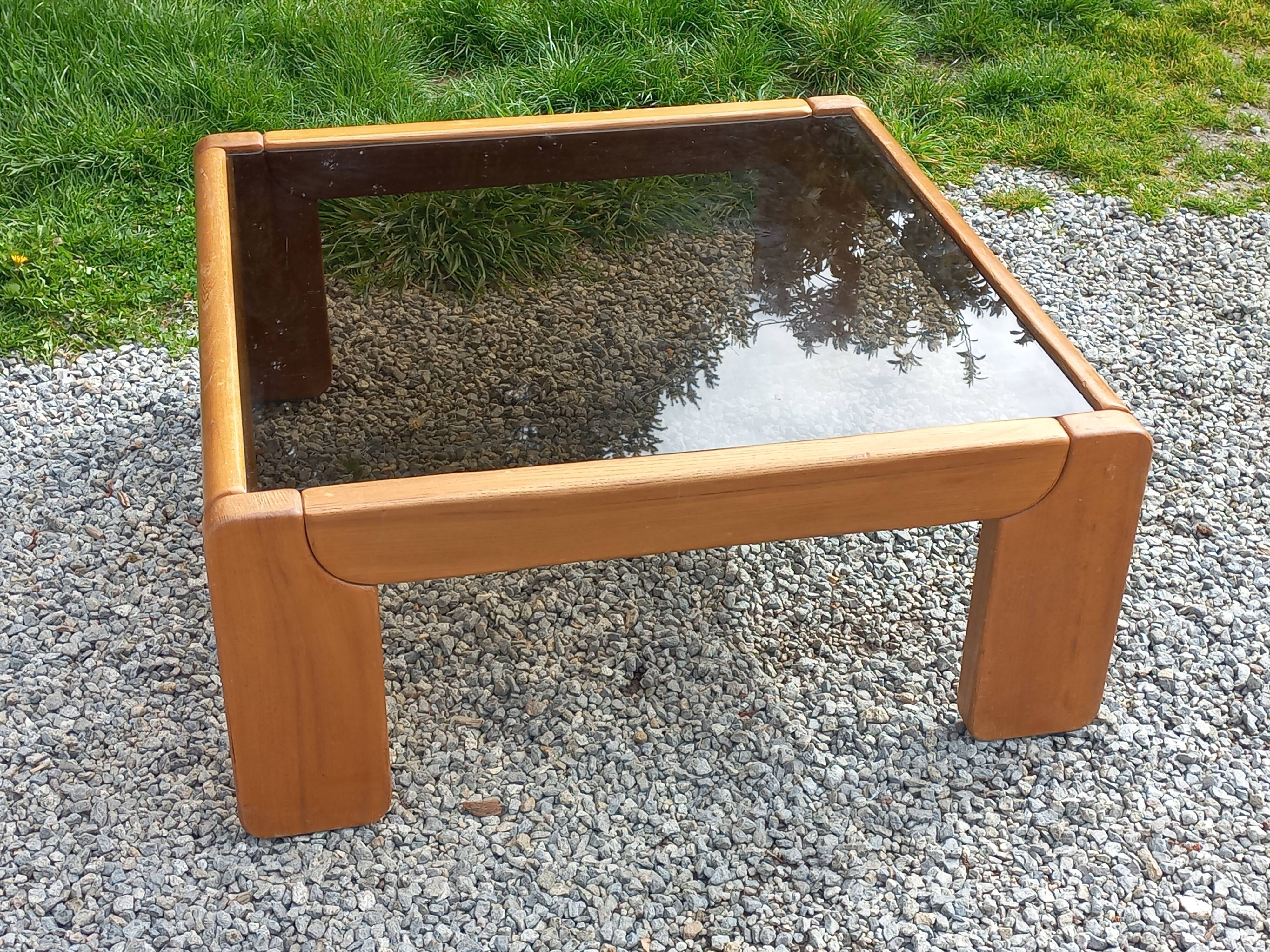 Coffee table from Regain in solid elm with a smoked glass top.