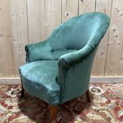 Napoleon III period crapaud armchair in green velvet.