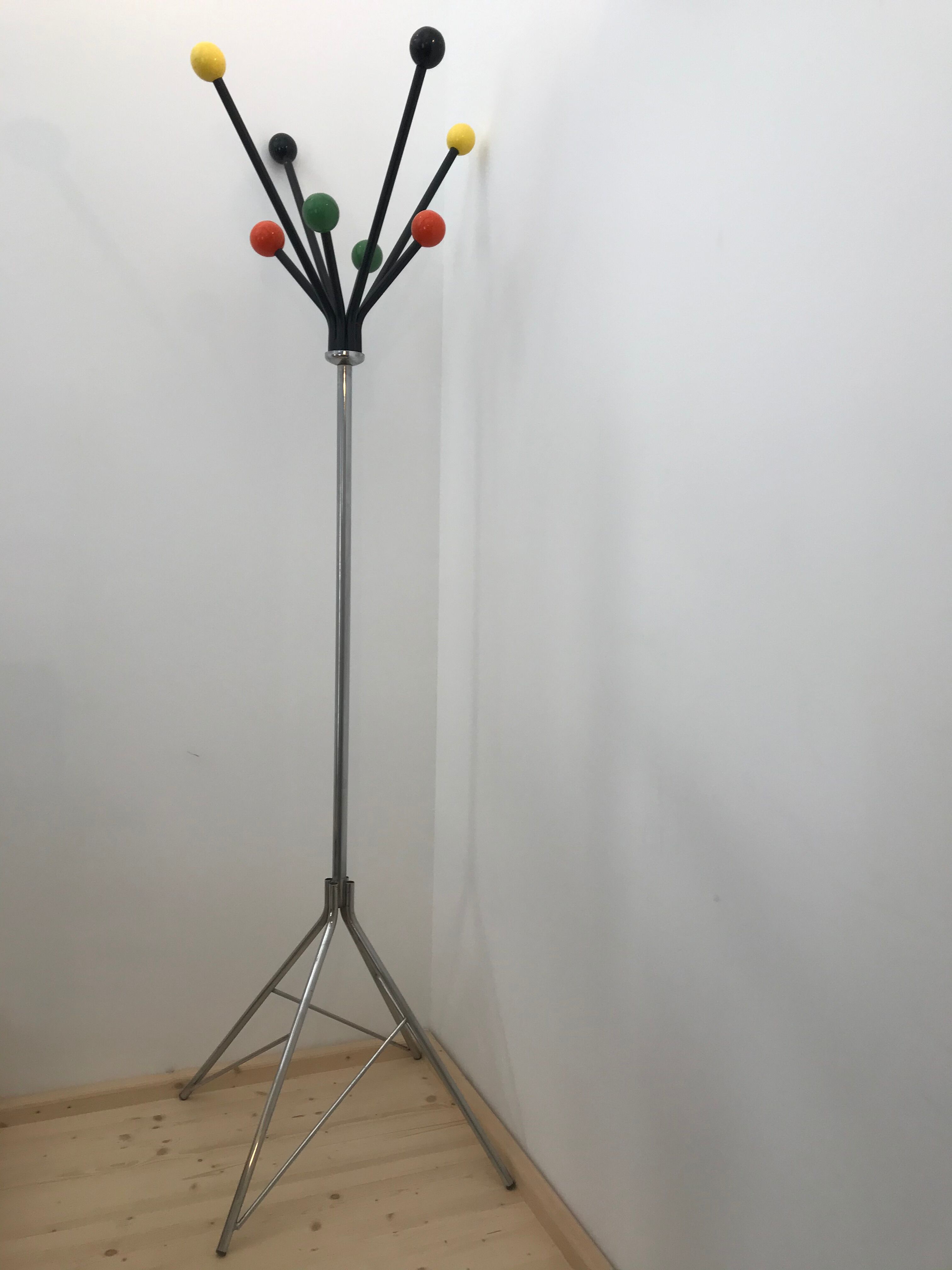 Wearing chrome parrot coat, black and multicolored balls