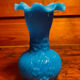Blue opaline vase, opaque glass, wavy neck/rim, relief decoration of a bow.