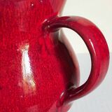 Vintage red enamel ceramic pitcher