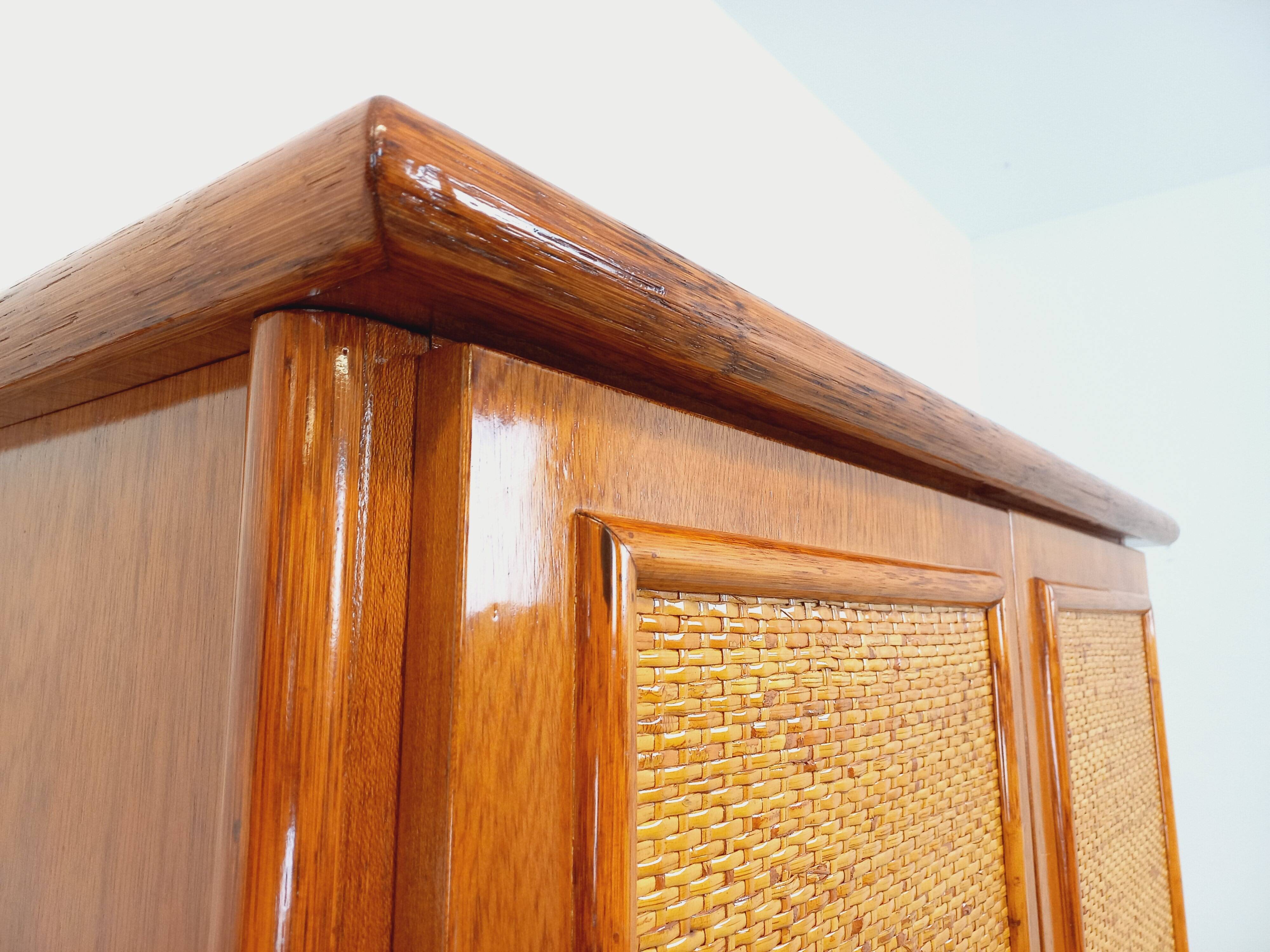 Vintage woven rattan and wood armoire by Maugrion for Roche-Bobois.