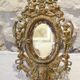 Miroir en bronze à décor d'angelots et mascarons fin 19ème siècle