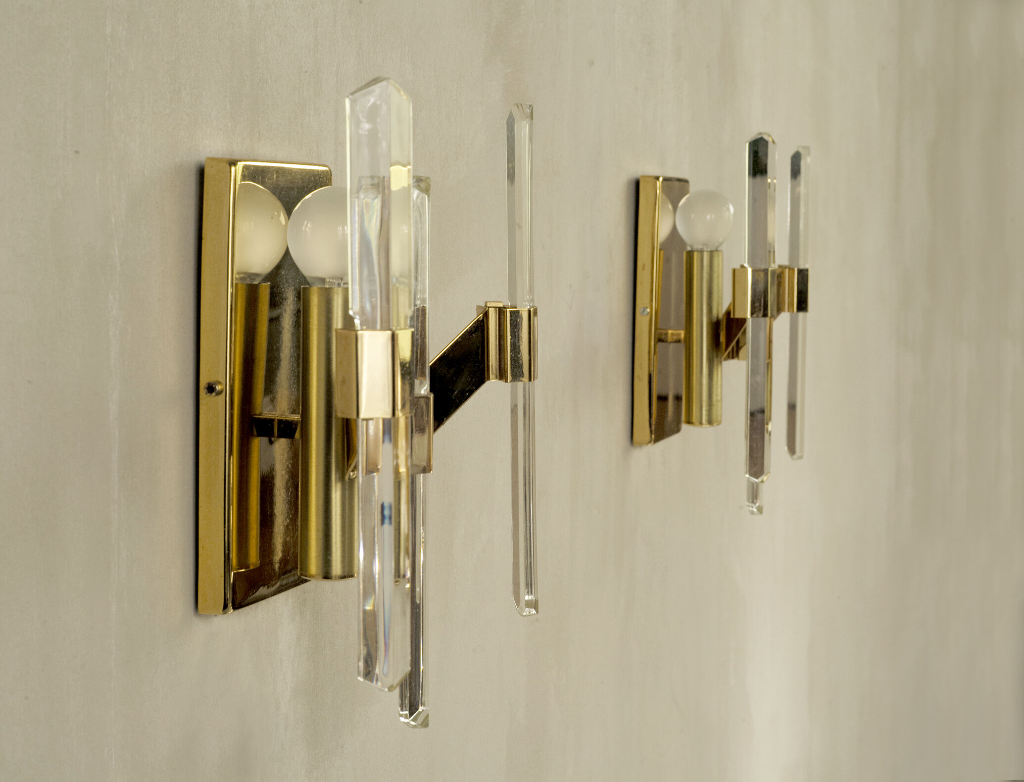Pair of wall lamps in glass and gilded metal Sciolari