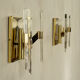 Pair of wall lamps in glass and gilded metal Sciolari