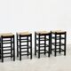 ensemble de quatre tabourets de bar en rotin et bois