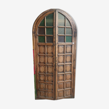 Ancient Indian door curved with colorful stained glass windows