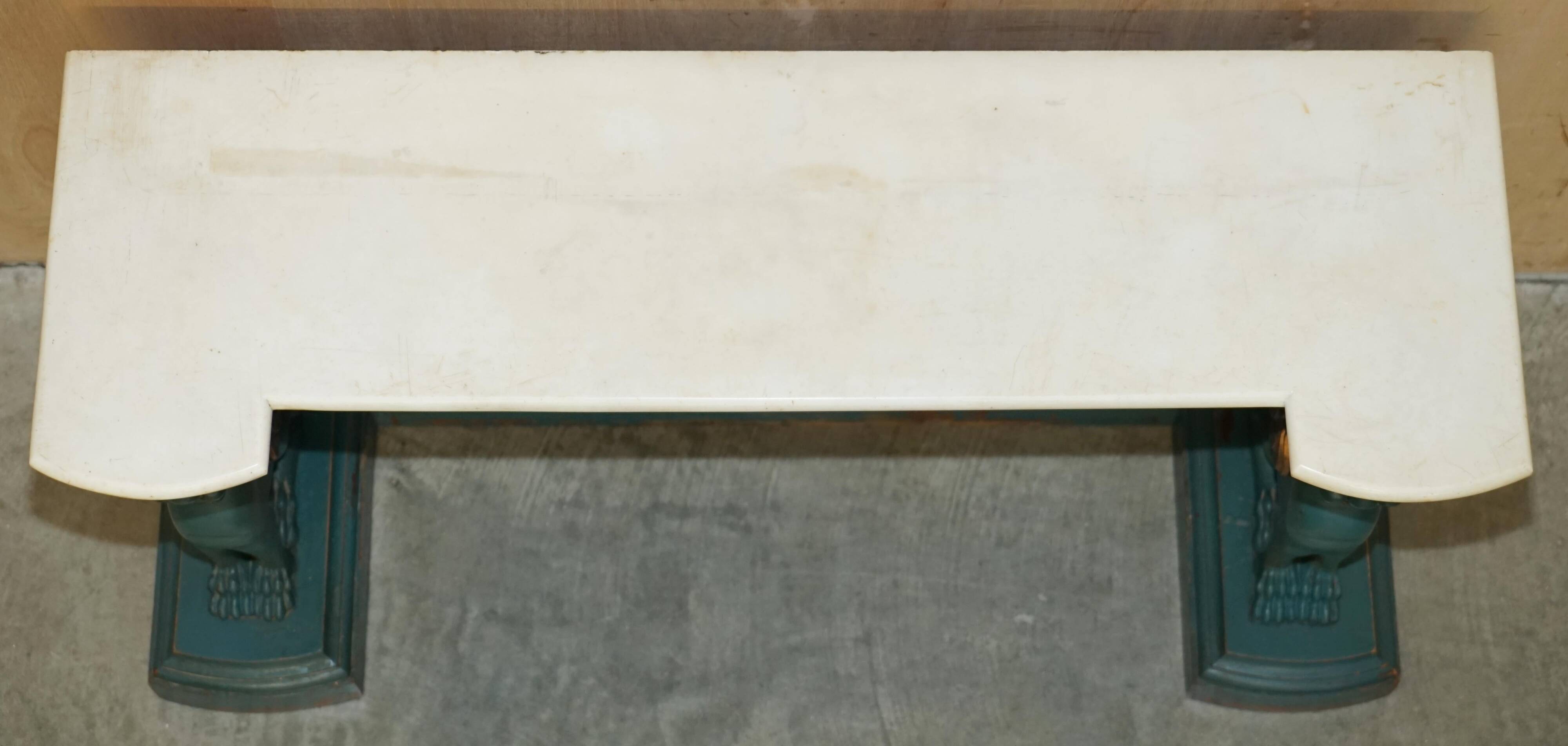 Antique hand-carved console circa 1880 with a marble top.