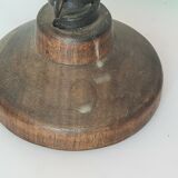 Candle holder with iron and wood pusher