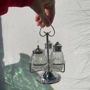 Silver-plated metal and glass salt and pepper shakers