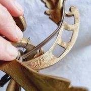 Pair of vintage French wall sconces in bronze, Louis XV Rococo style.