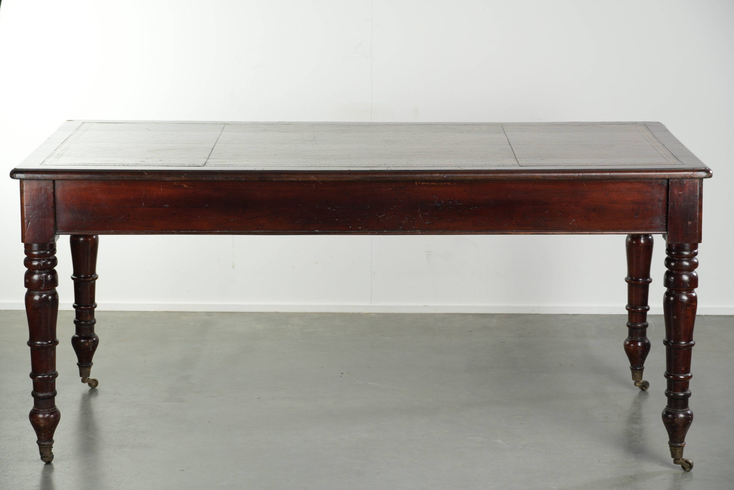 Antique English writing desk from the late 19th century with a warm colour