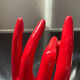 Vintage red ceramic hand paperweight