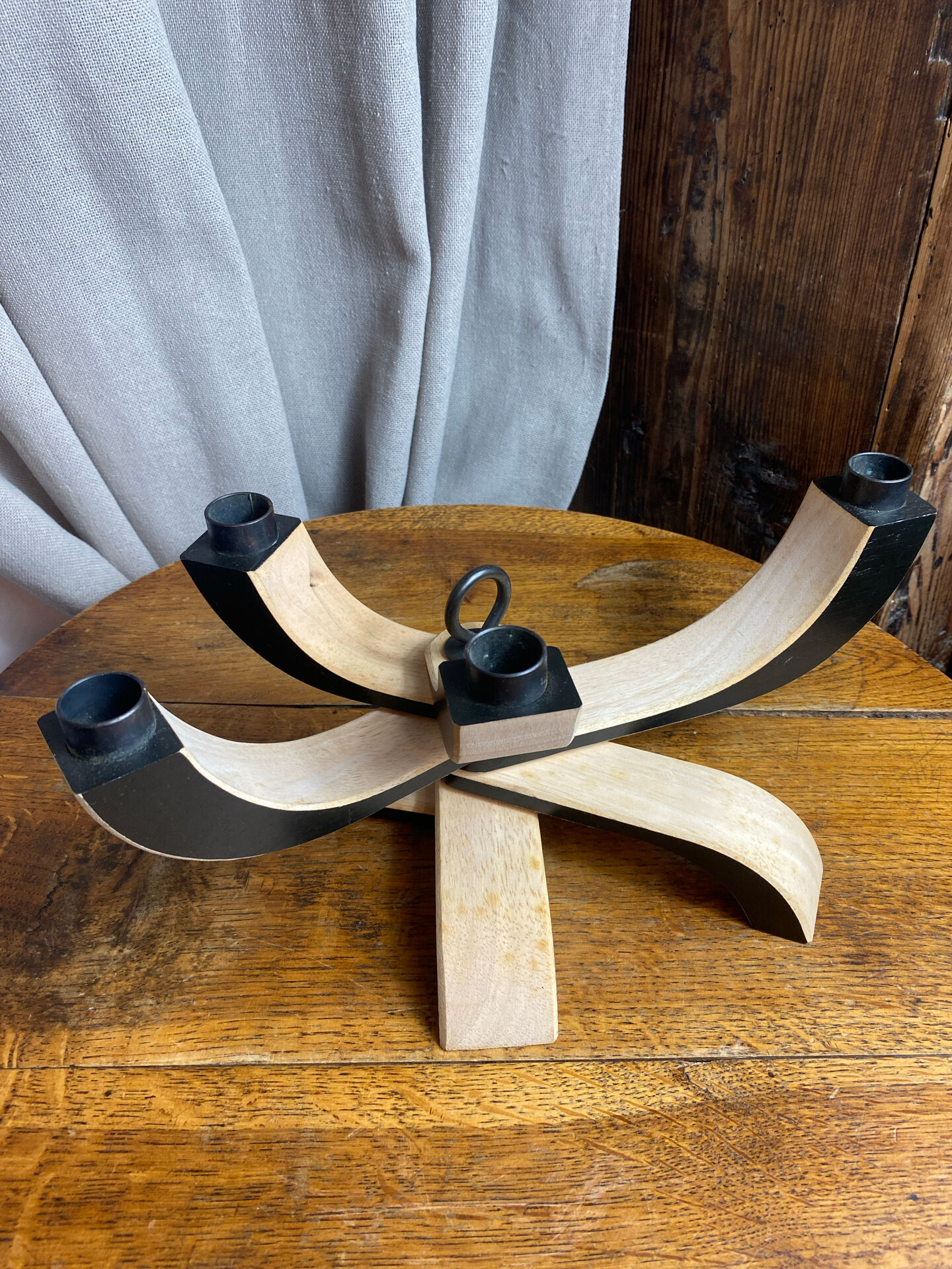 Foldable and deconstructed chandelier, minimalist Swedish design in wood.