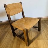 Pair of low wooden and straw armchairs