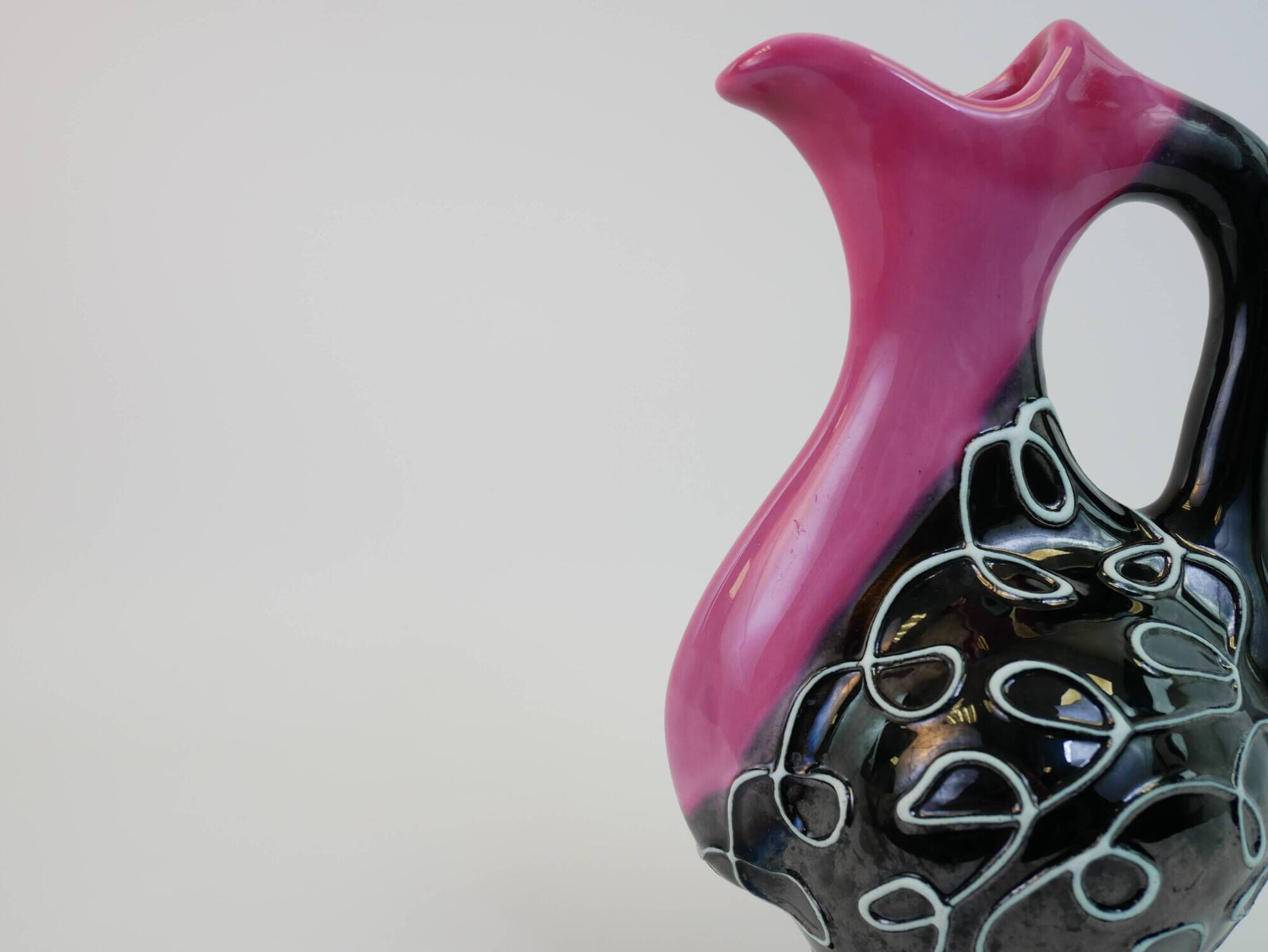 Black and pink Vallauris carafe with white relief patterns