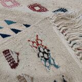 White margoum carpet with multicolored Berber patterns