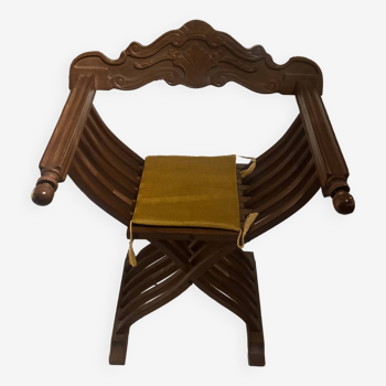 Curule wooden armchair