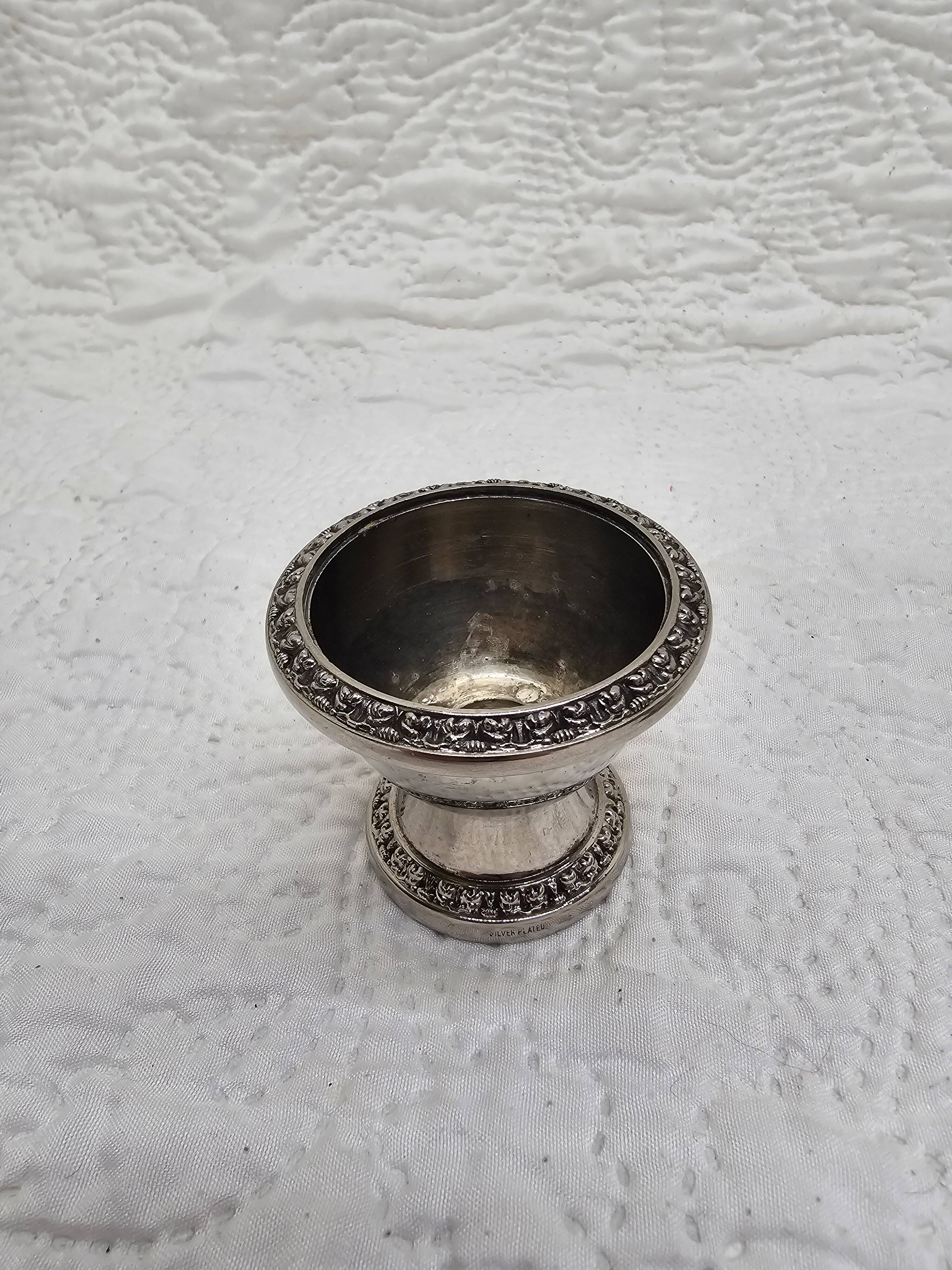 Silver-plated salt and pepper shakers and egg cups