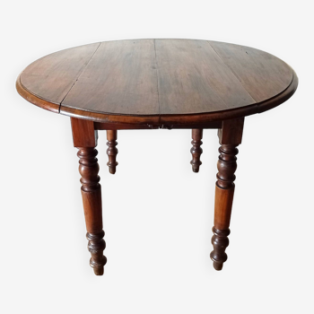 Oval table with flaps