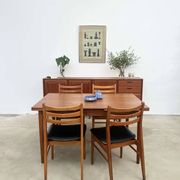 Teak dining table with integrated extensions — Scandinavian