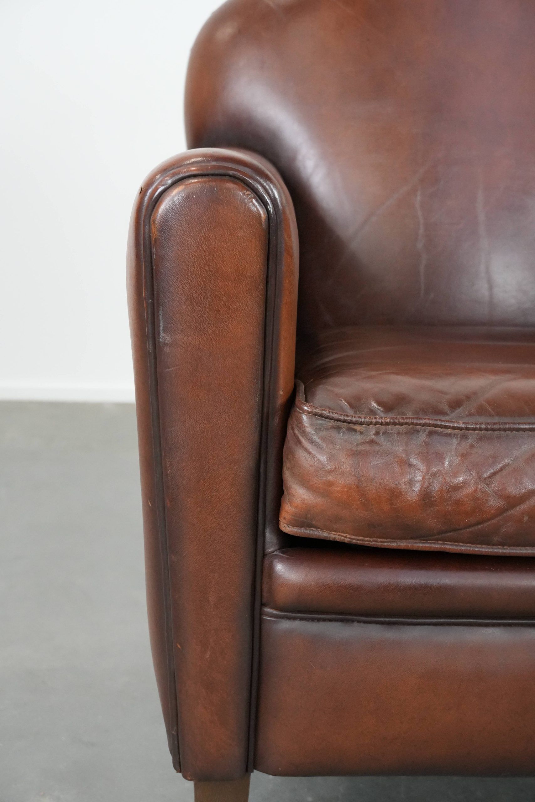 Sheepskin art deco design armchair with timeless and warm colours