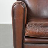 Sheepskin art deco design armchair with timeless and warm colours