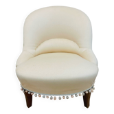 Fauteuil crapaud en tissu rose pâle et pieds en bois